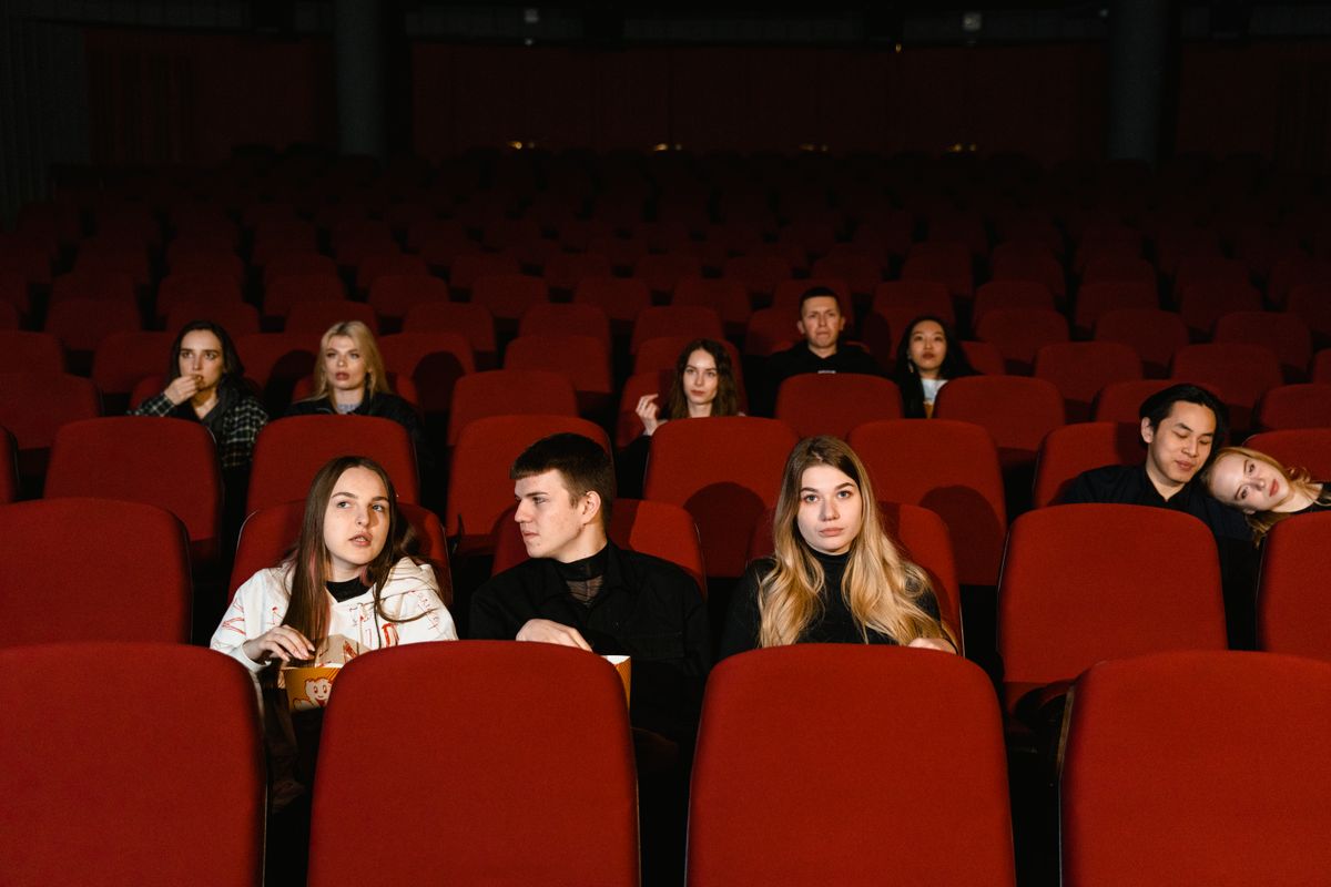 An audience watching a film in a cinema